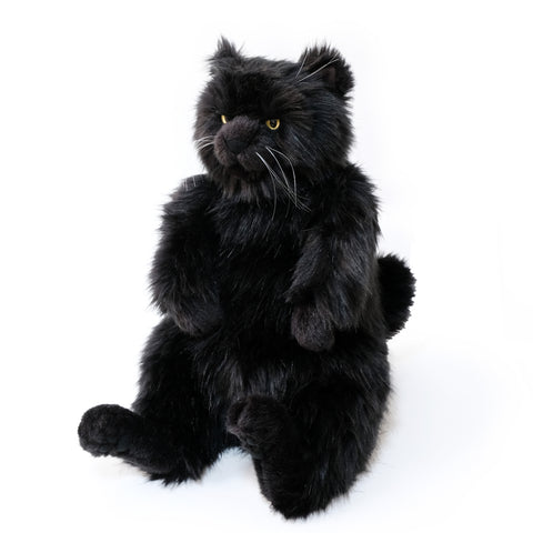 The strongest black cat in history, a brave stuffed toy with long hair and bright yellow eyes