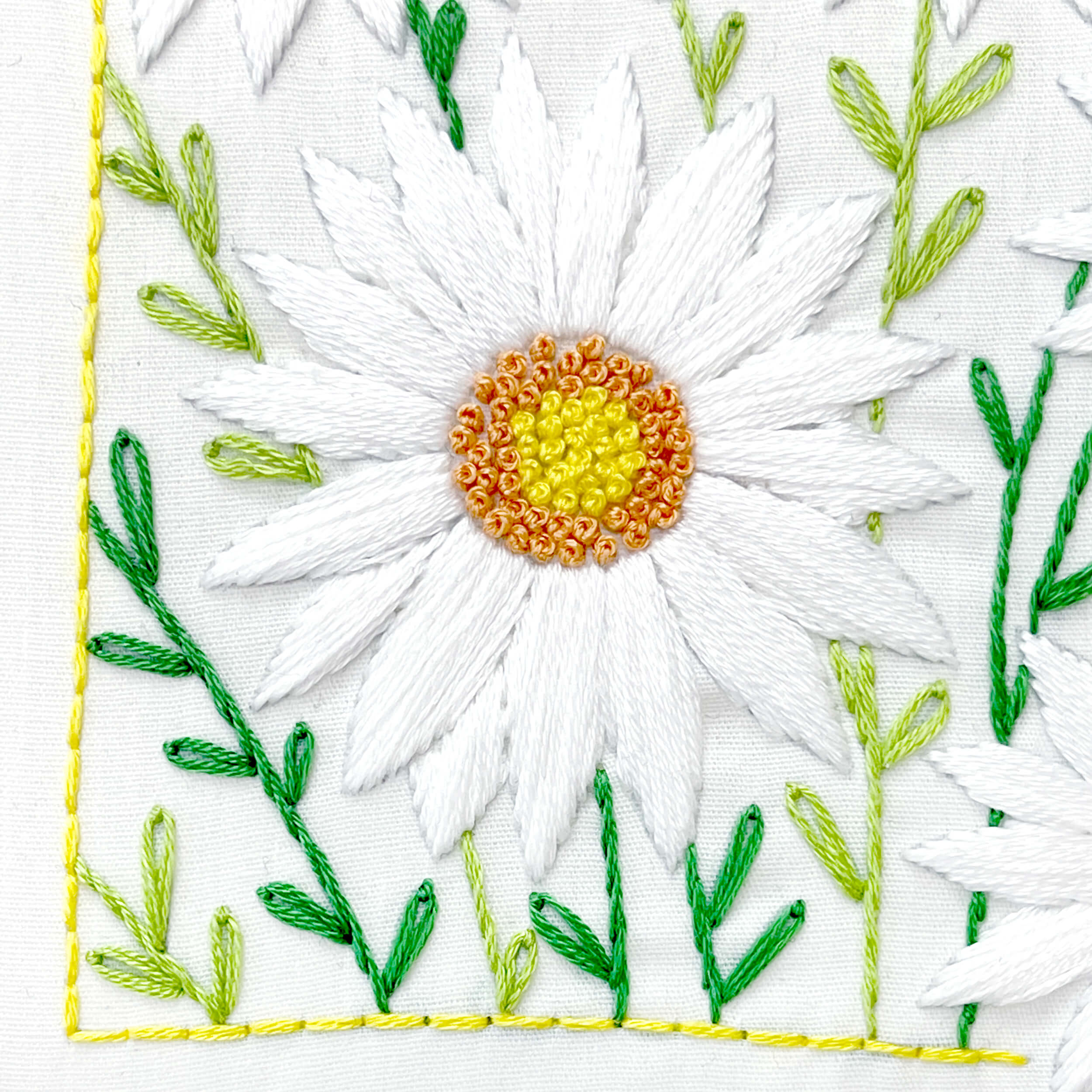 close up of the daisy with french knot center