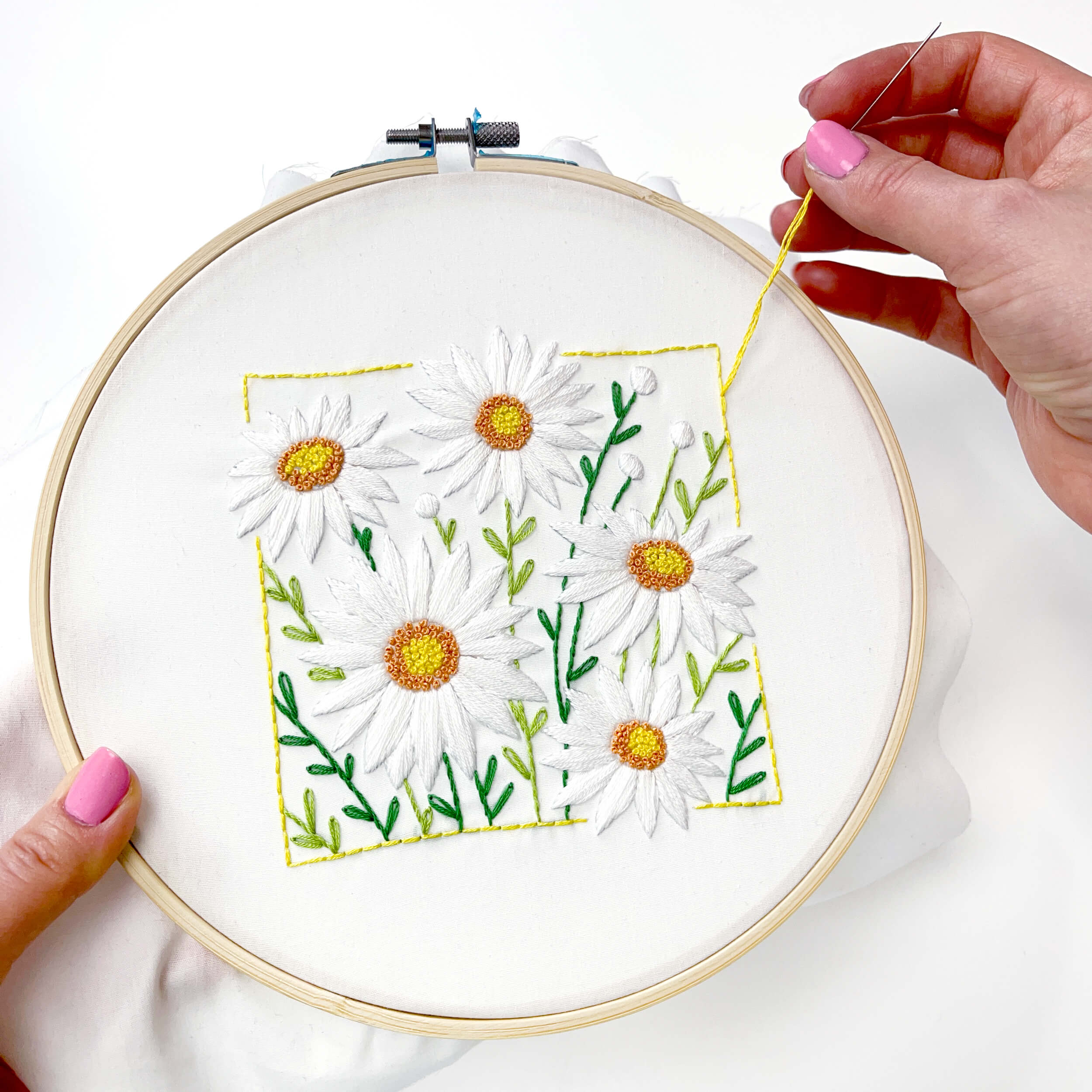 hand stitching the april daisy embroidery pattern
