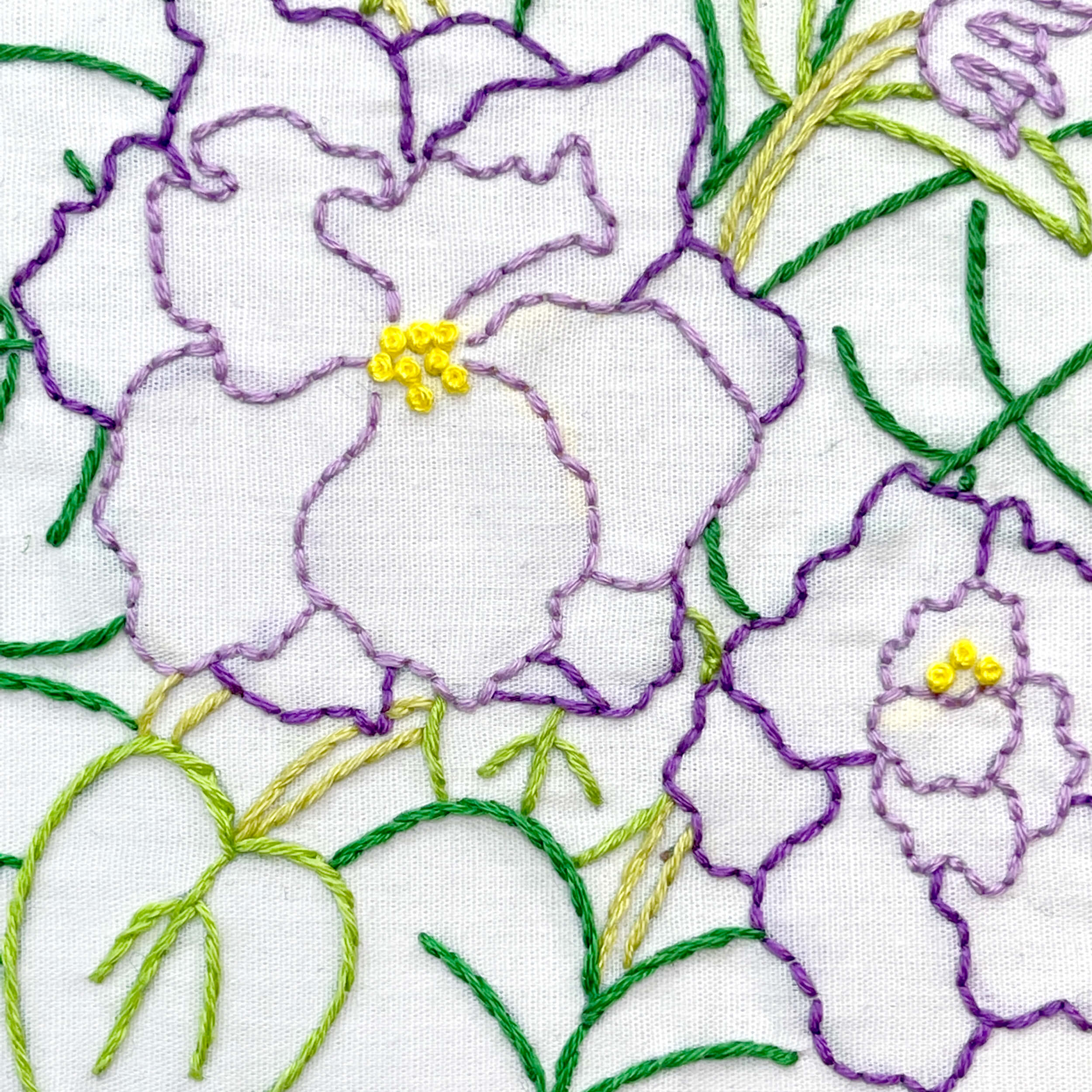 close up of african violet embroidery in purple