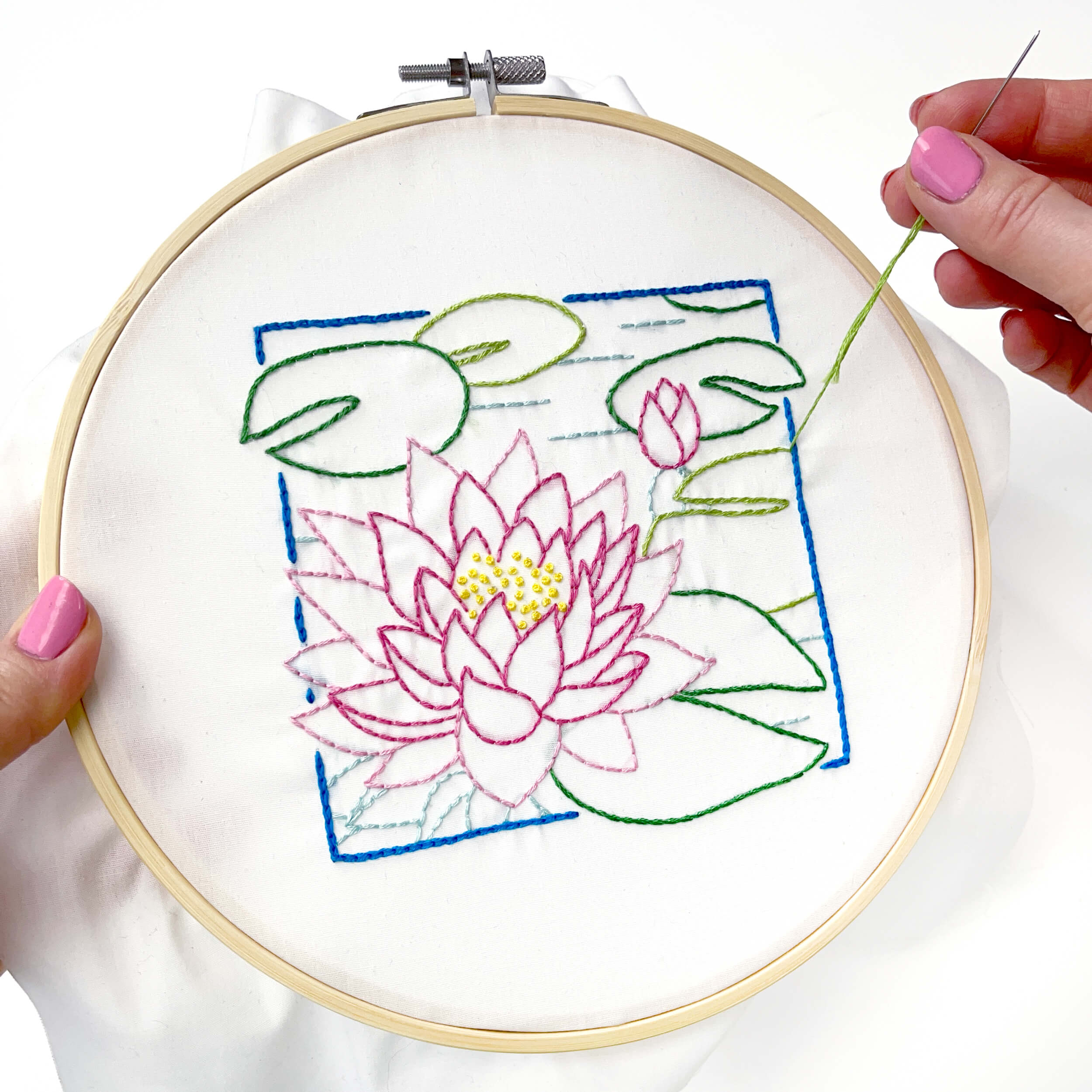 Hand stitching the July Water lily with blue embroidery floss