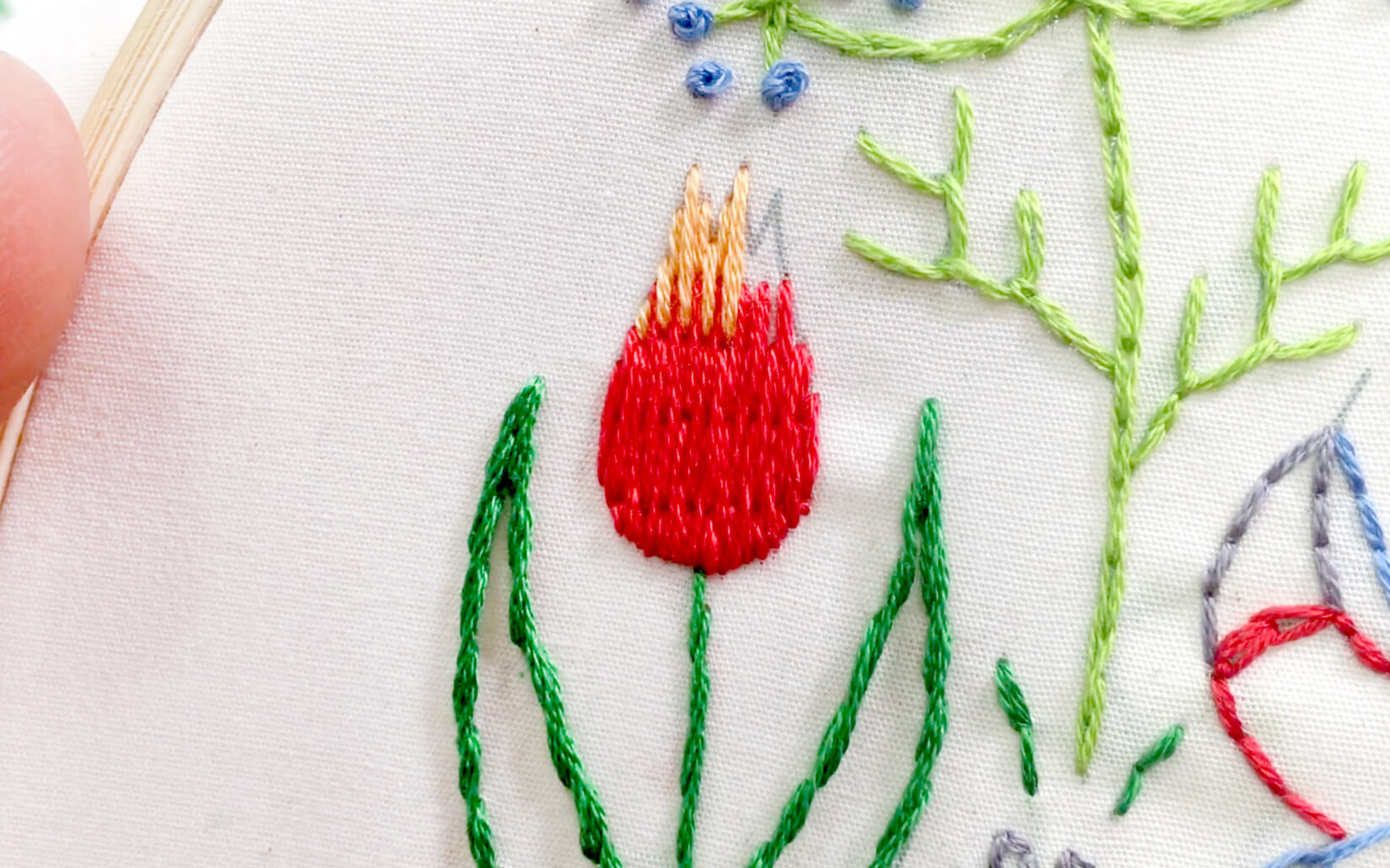 Image of long and short stitch used in the Stitching Raccoon Sampler as the tulip