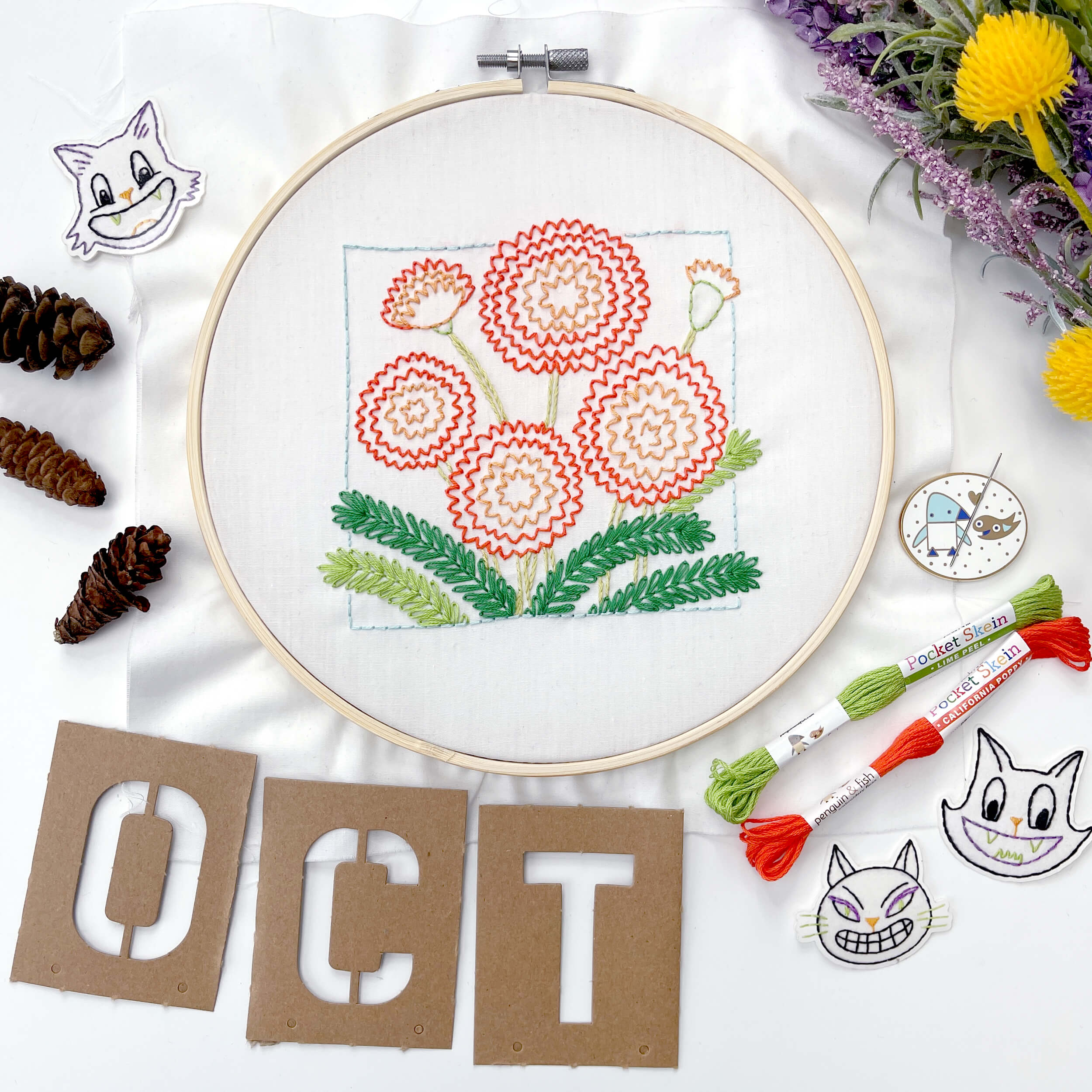 Finished October Marigold embroidery pattern with letters OCT under it
