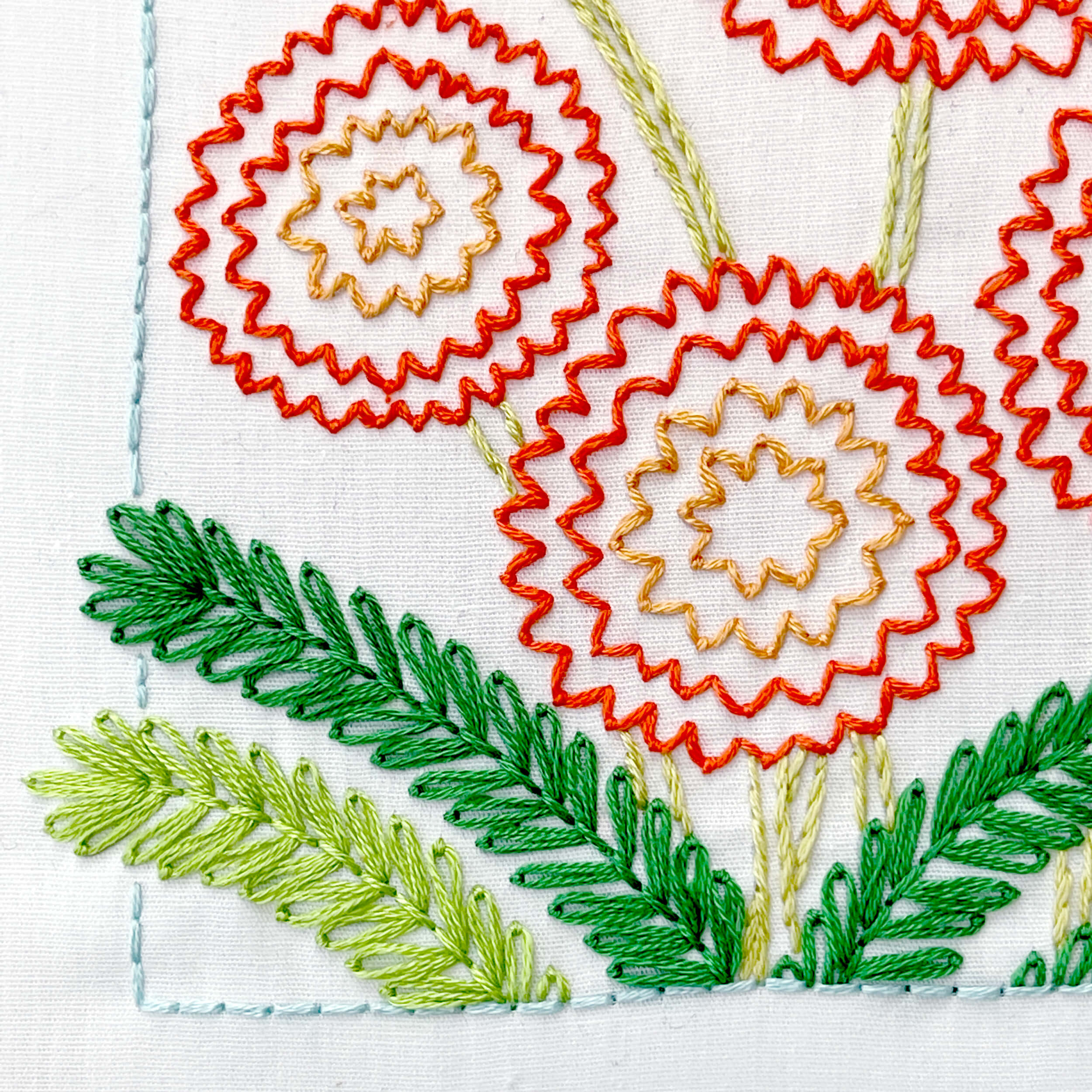 backstitch outline and marigold flower and leafs