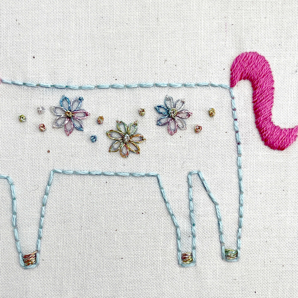 Unicorn body with metallic flowers and pink tail