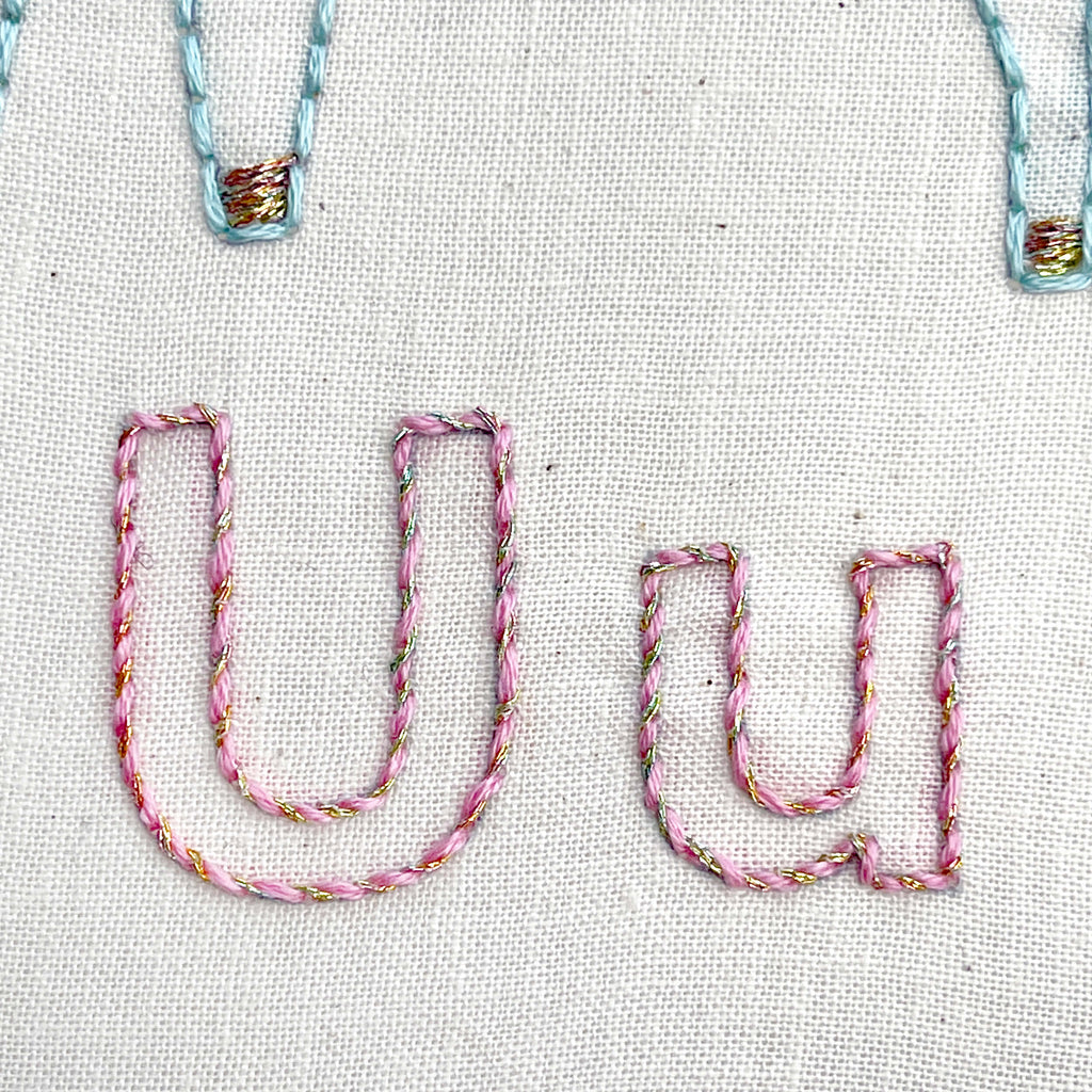 Letters Uu embroidered using whipped back stitch