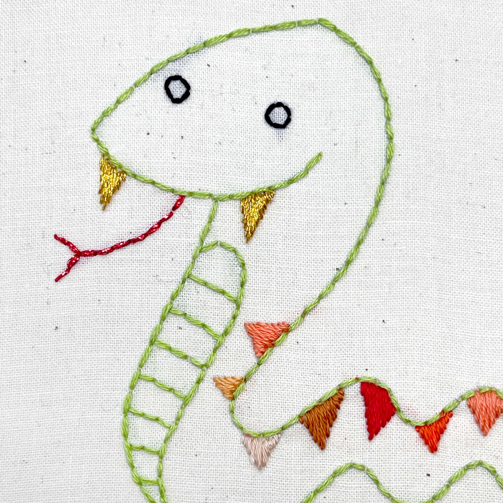 Snake with sparkling fang teeth and red tongue