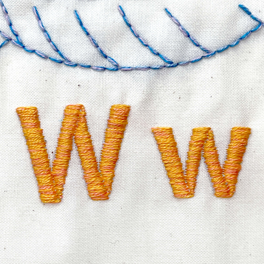 Satin stitch Ww letters in orange