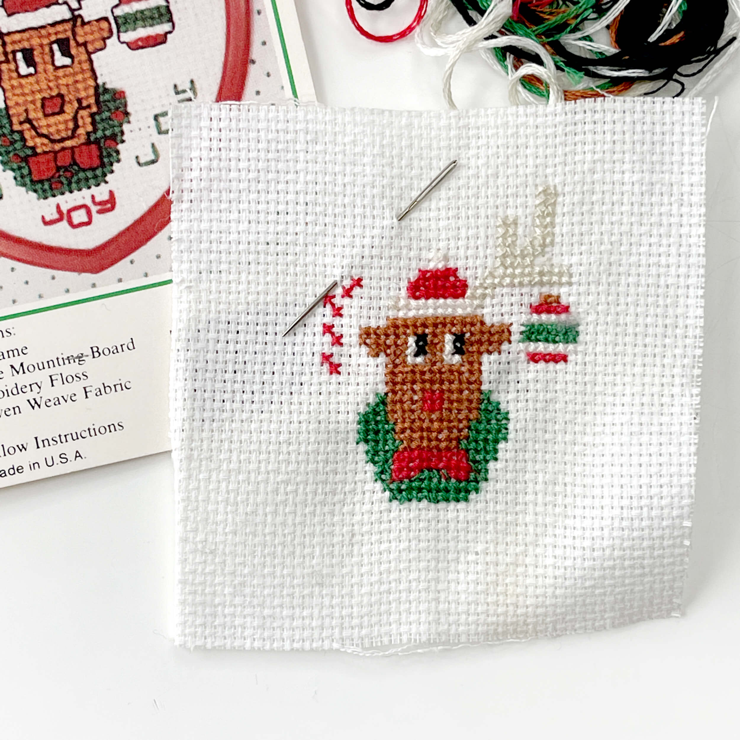 cross stitch project of a reindeer