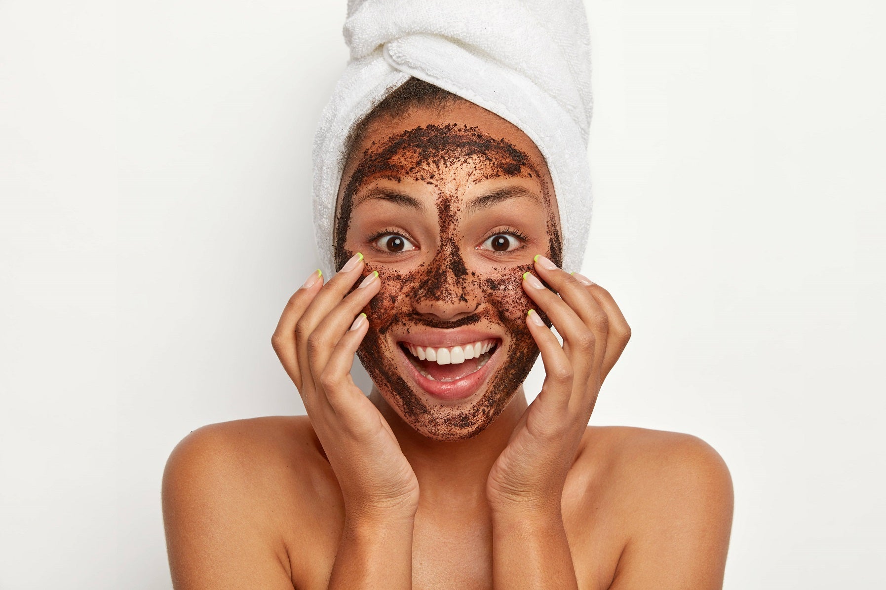 A beautiful women applying face scrub on face