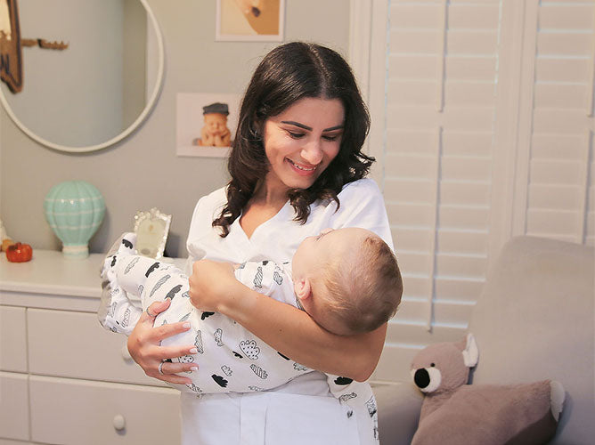 Nicole Morales holding a baby