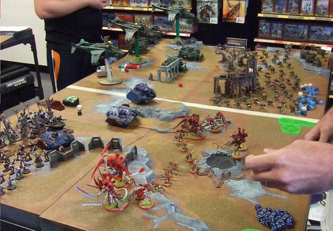 a group of people playing warhammer 40000