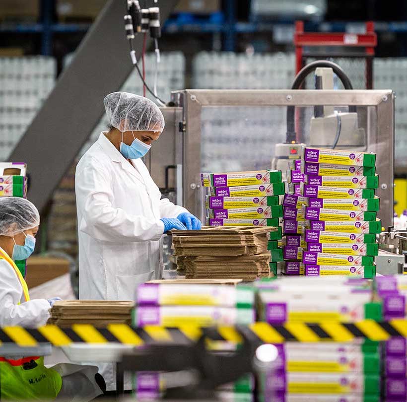 Workers preparing packaging