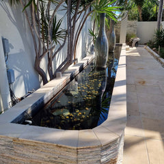 fish pond completely waterproofed with liquid rubber and filled with water