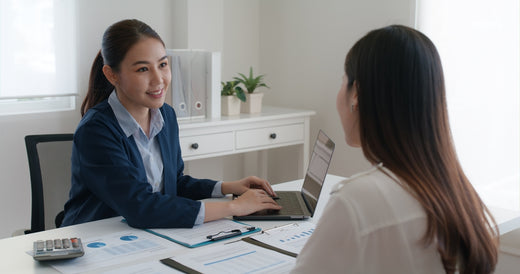 Two females discussing about tax accounting and bookkeeping services