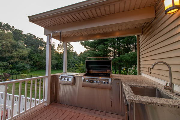 An outdoor countertop by a porch.