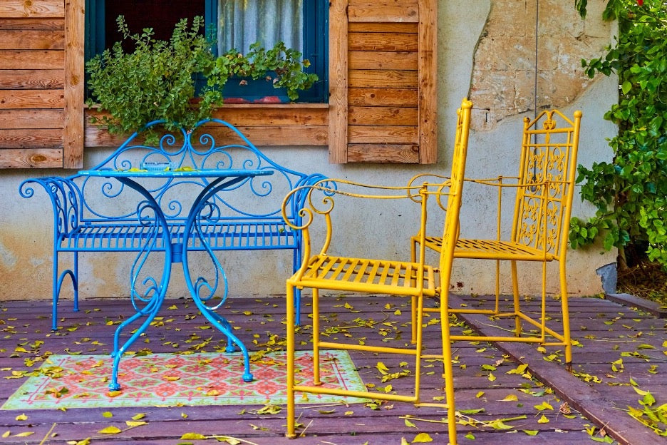 Metal furniture in blue and yellow.