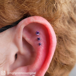 Ear pierced with 3 Prong Set Fancy Purple Gem Ends