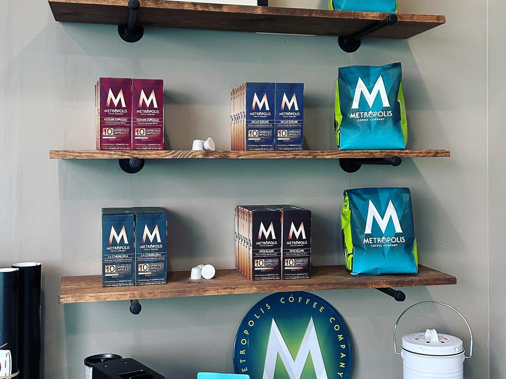 Metropolis Coffee compostable coffee capsules on a shelf.