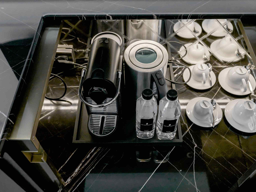 A coffee brewing station in a hotel room.