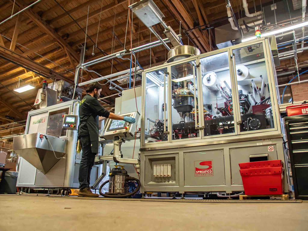 Manufacturing Metropolis private label coffee capsules at a factory.