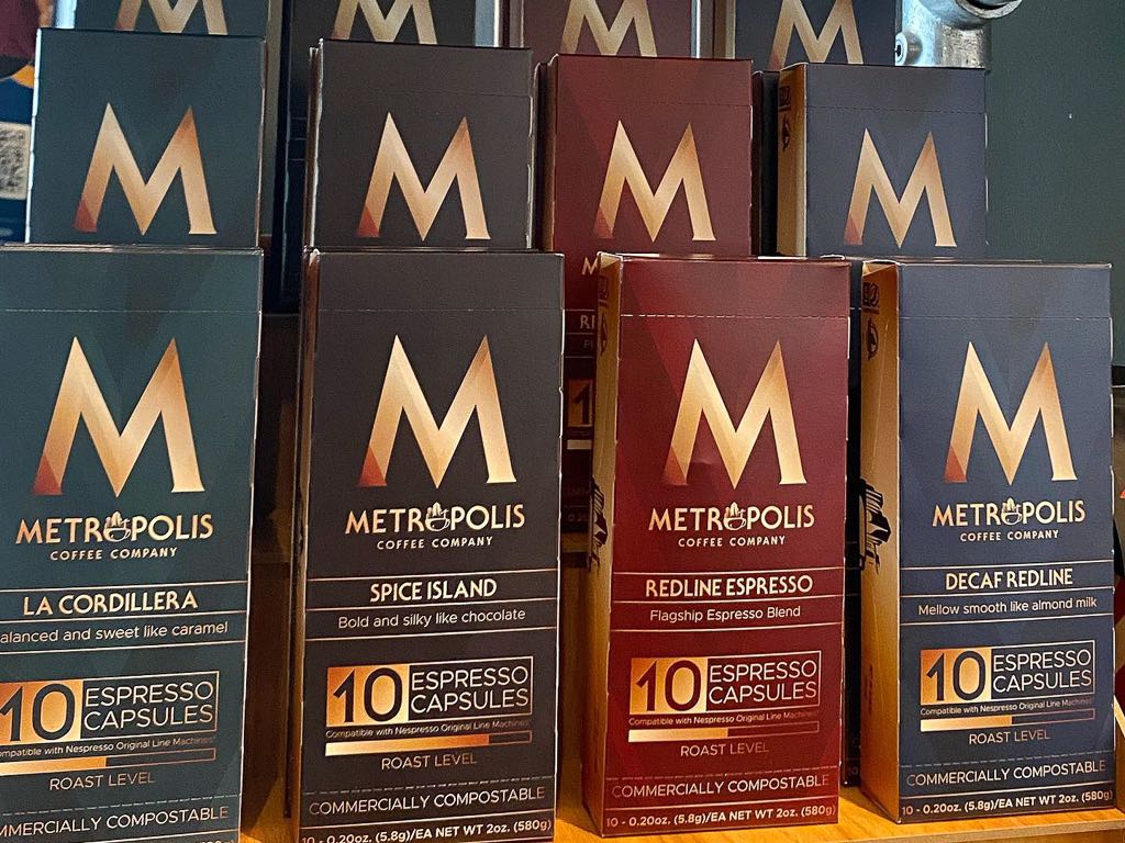 Metropolis coffee capsules packaging on display.
