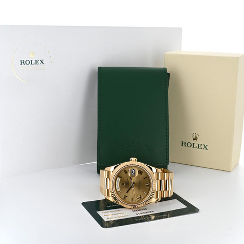 Image of gold rolex watch with authentication card and paperwork | Buchroeders Jewelers
