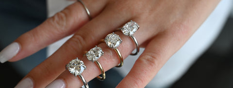 engagement rings stacked on finger