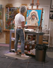 Lynn Samis painting in studio.