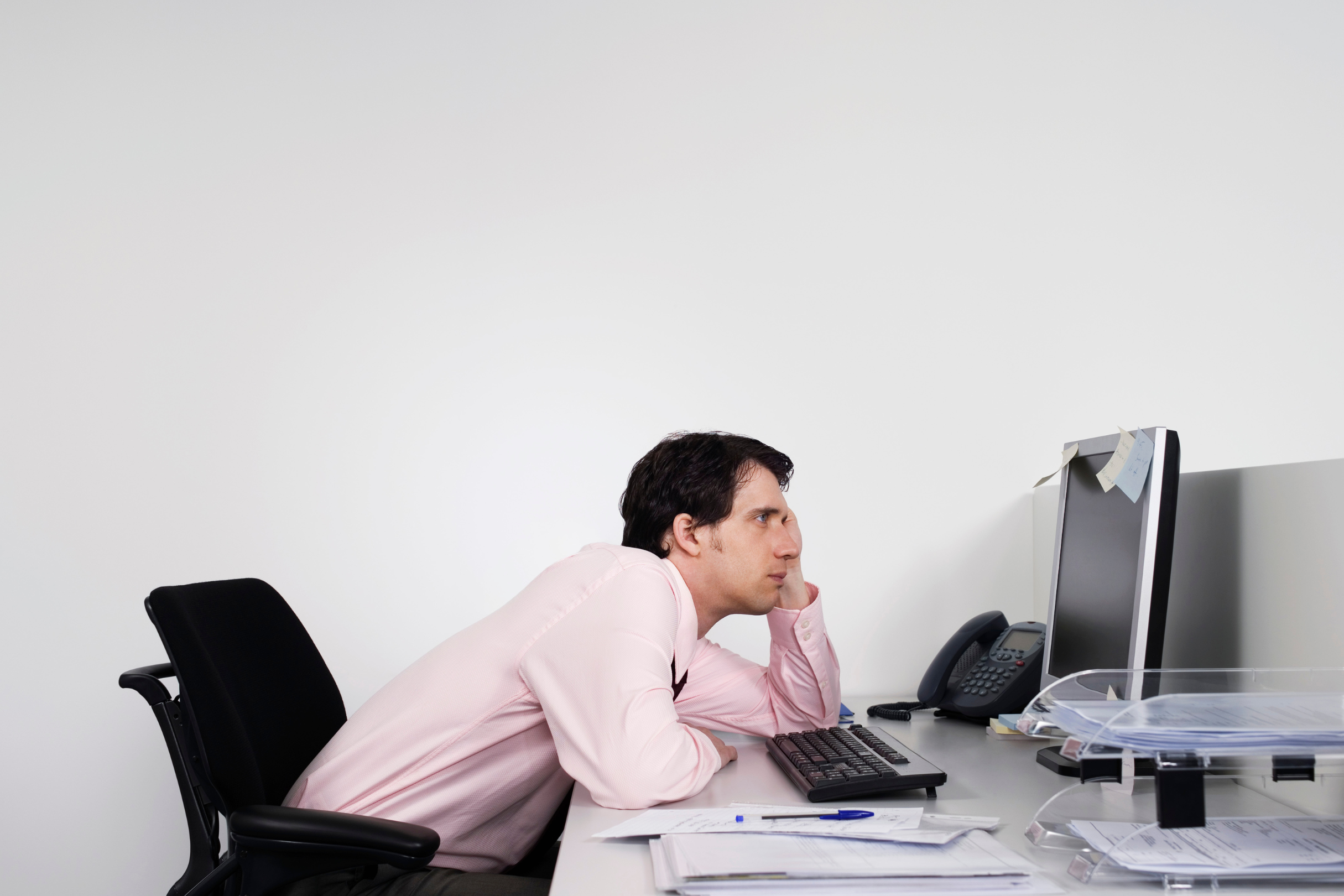 Someone slouching at their desk