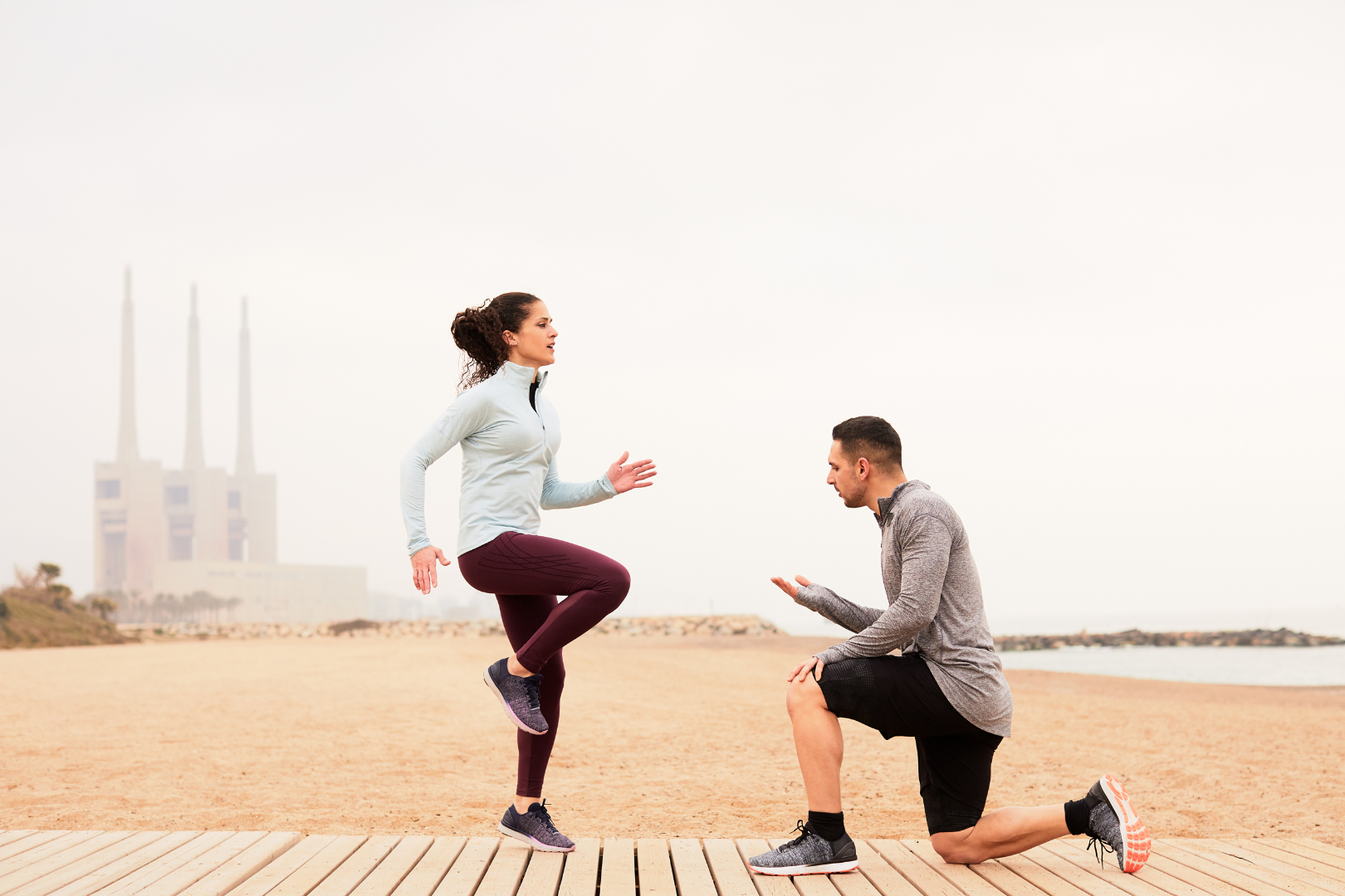 Running coach working with a runner