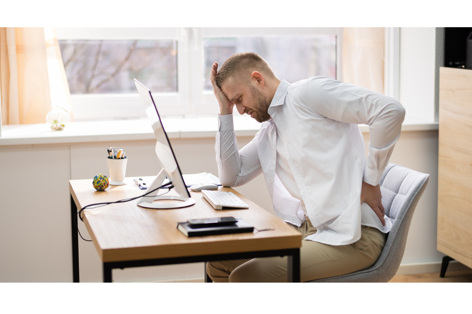 Someone with poor posture experiencing a headache