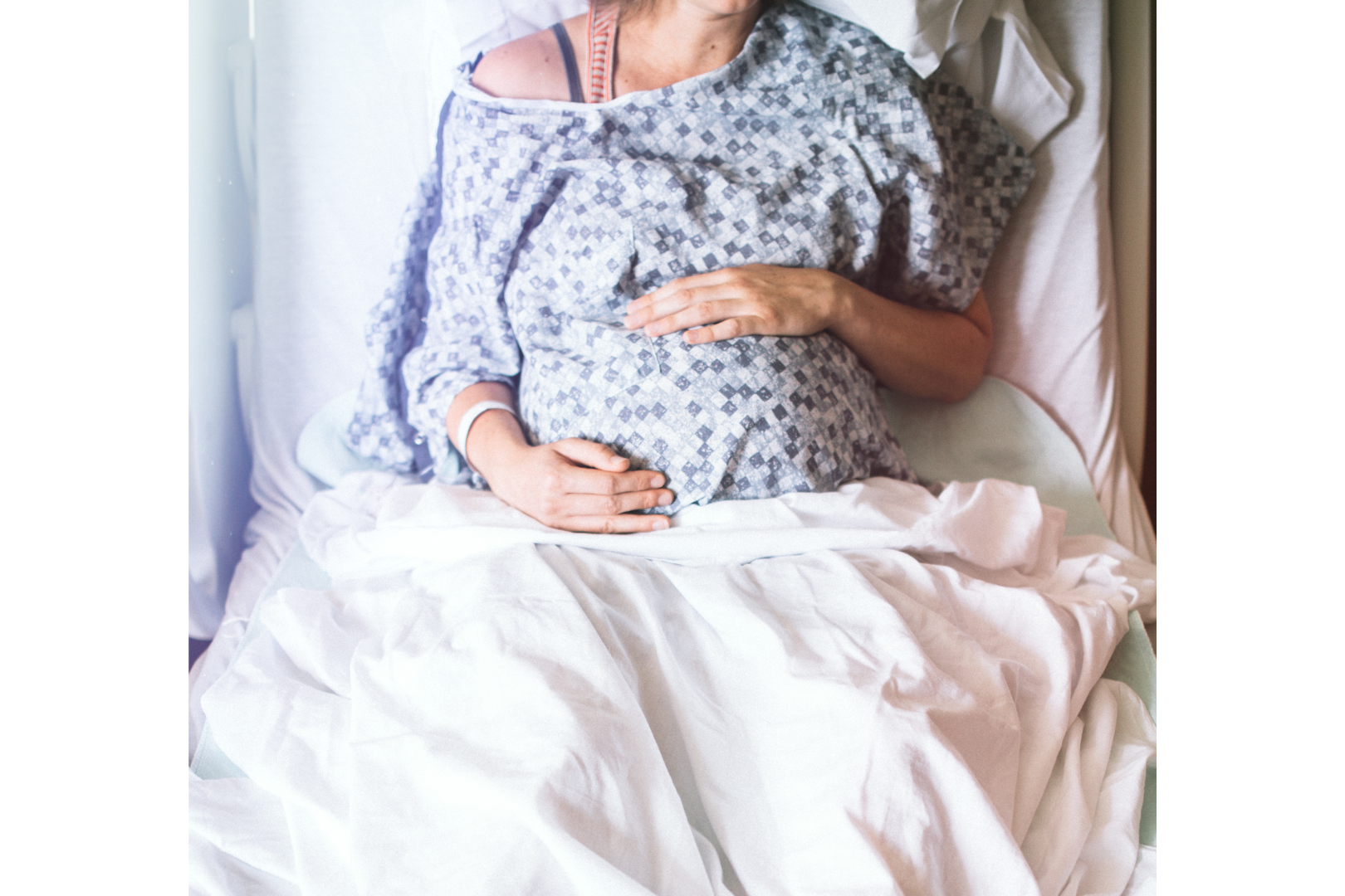 A pregnant woman in a hospital bed