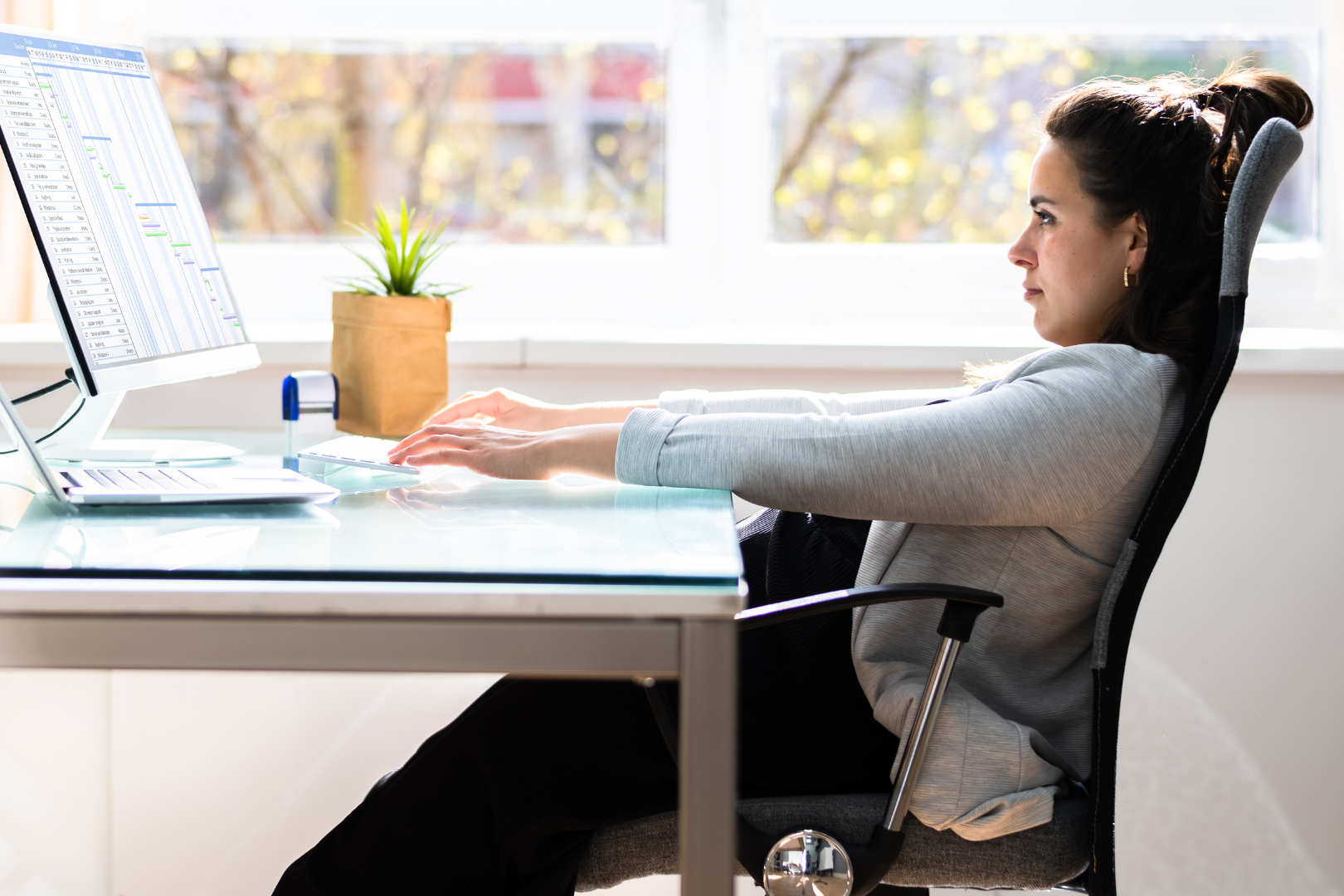 A person slouching at their desk