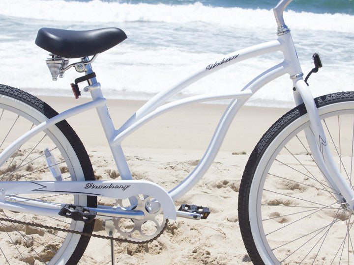 white cruiser bike with basket