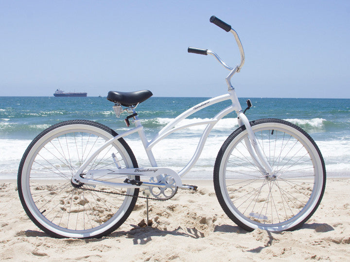 white cruiser bike with basket