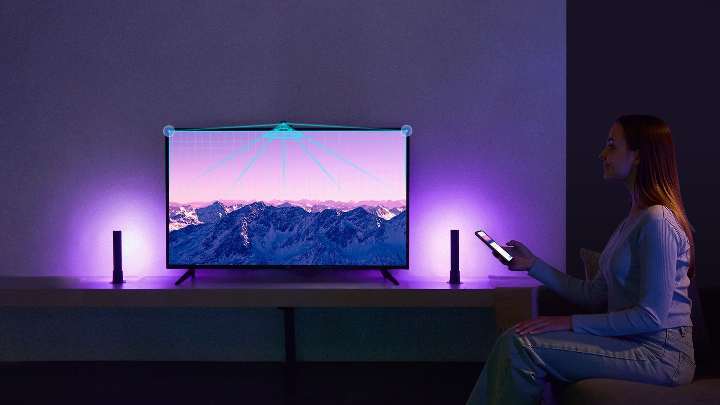 a person sitting on a desk looking at a screen