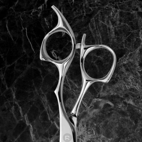 artistically designed finger holes and a permanent finger rest on these hair scissors
