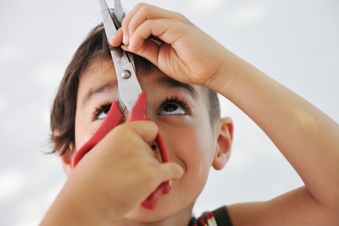 cut boy's hair with scissors