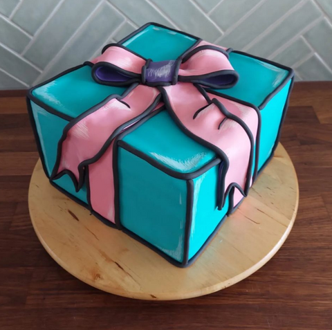 Gift package shaped comic cake
