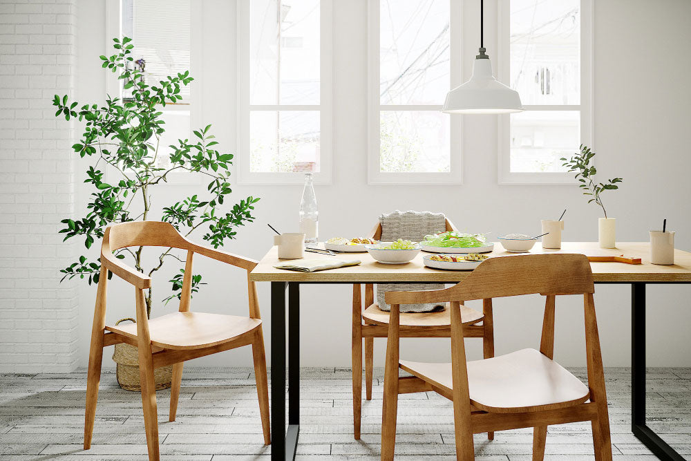 Dining room with plants, wooden table and natural materials