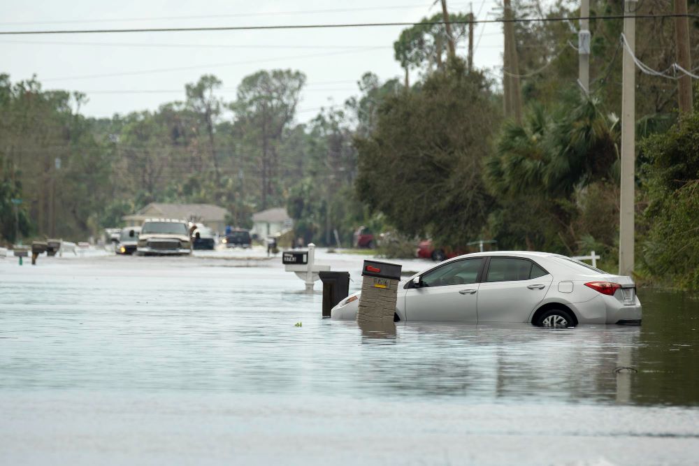 Flooded street with trapped car in a residential area in Florida after the hurricane made landfall