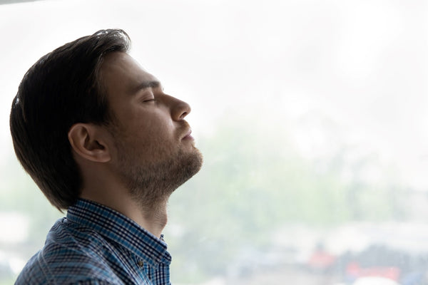 Odor Control with Misting System: Man Enjoys Fresh Air