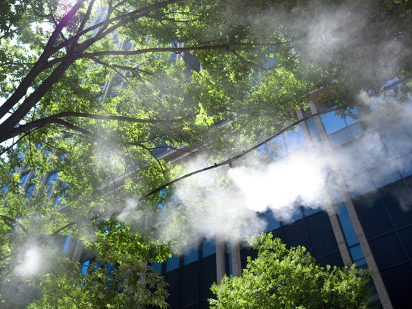 An outdoor misting system spraying fine mist