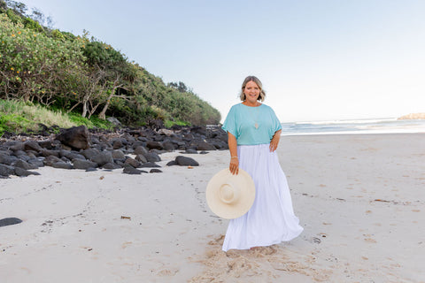 Packing bamboo holiday outfits, white skirt, aqua top, floppy hat NATALI THE LABEL