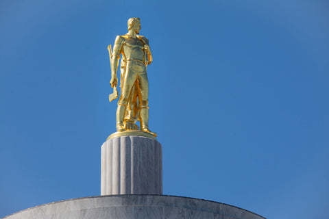 The Oregon Pioneer statue atop the Oregon Capitol Building in Salem