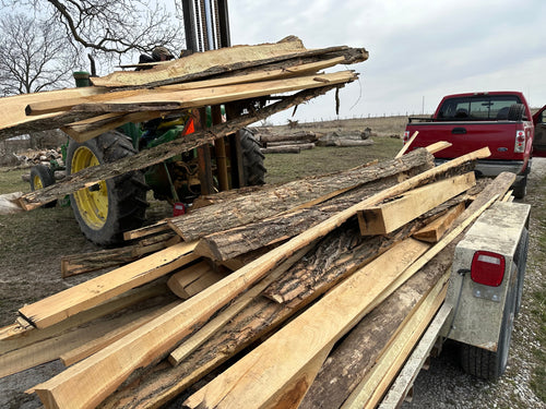 loading cheap firewood on trailer