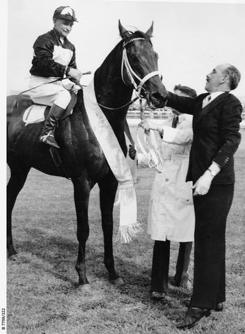 Waxwings after his record-breaking win at the South Australian Derby in 1940, with jockey R. Medhurst. Image: State Library of South Australia. ‘Mick’ Medhurst holds the record as the most successful jockey in the SA Derby, with five wins: 1937 Golden Hill – 1938 Tempest – 1940 Waxwings – 1941 Lamond – 1951 Beau Cavalier.