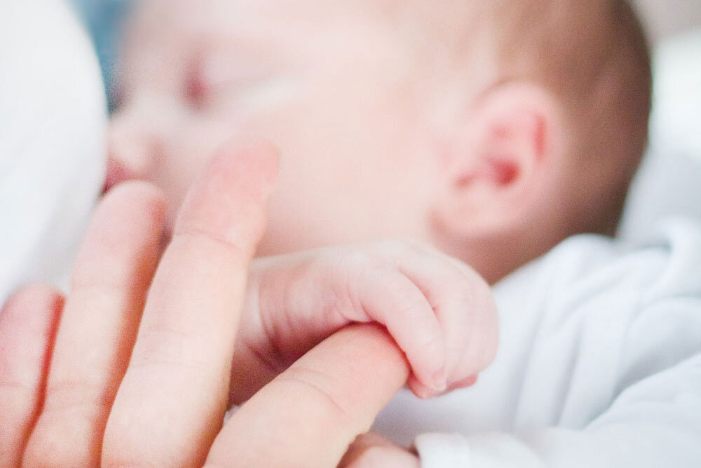 Newborn baby breastfeeding milk with endocannabinoids from its mother