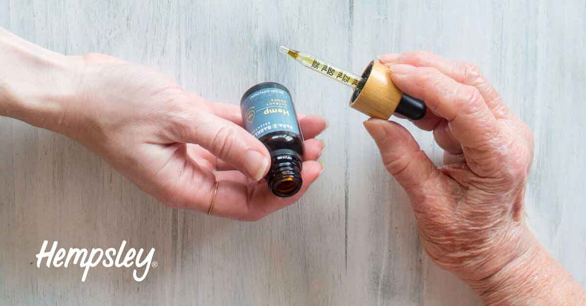 Elderly person and young person holding Papa and Barkley's CBD Releaf Drops